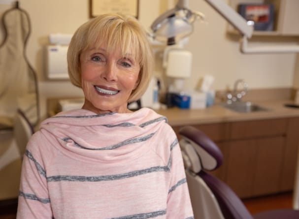 Woman with new denture smiling