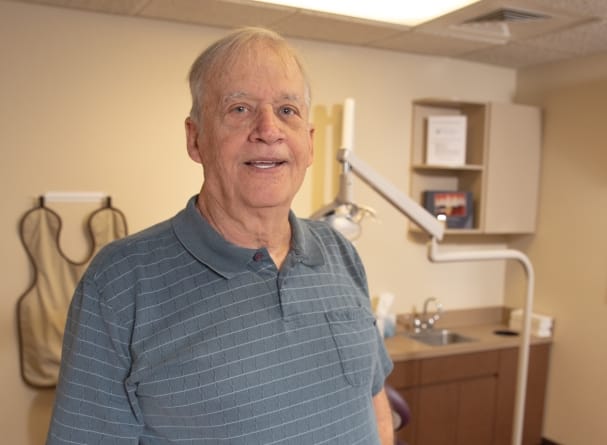 Dental patient smiling after orthodontic treatment