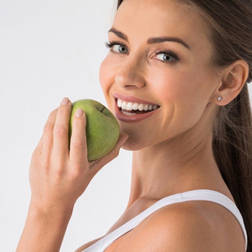 Eating an apple with the help of mini dental implants