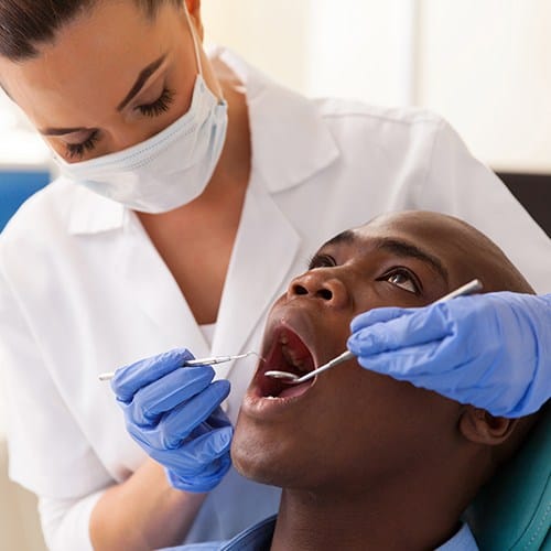 Man receiving preventive dentistry checkup