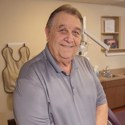 Dental patient smiling after sinus lift treatment