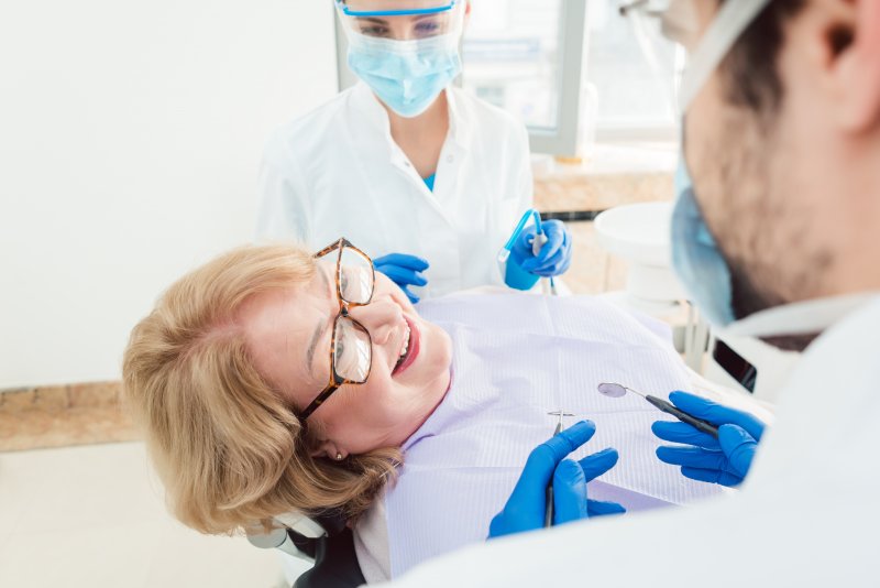 Woman smiling at dentist appointment