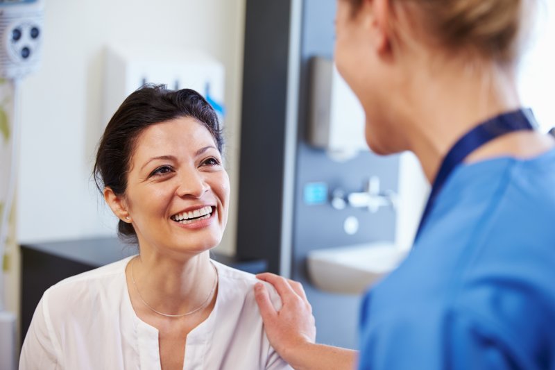 Dentist explaining sinus lift treatment to a patient