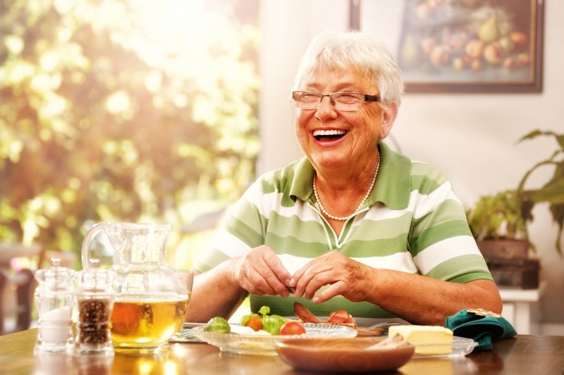 Woman eating with dentures
