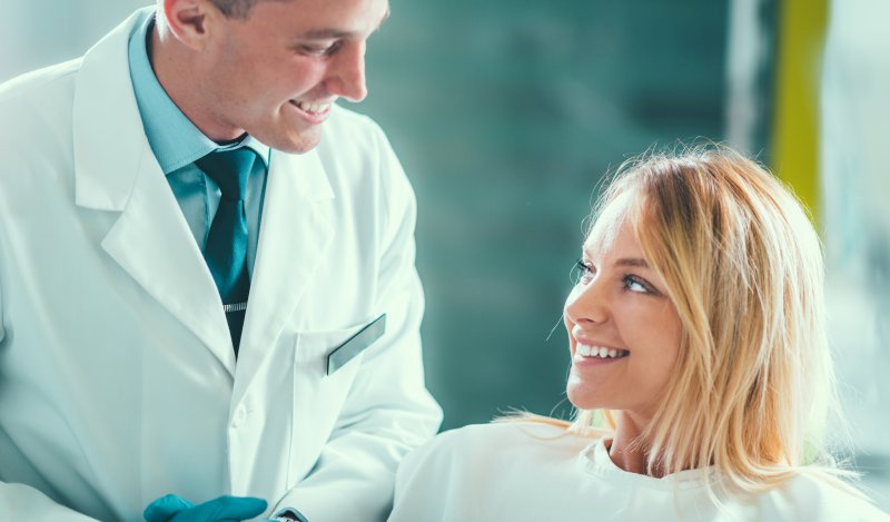 woman smiling during cosmetic dental consultation in Naples