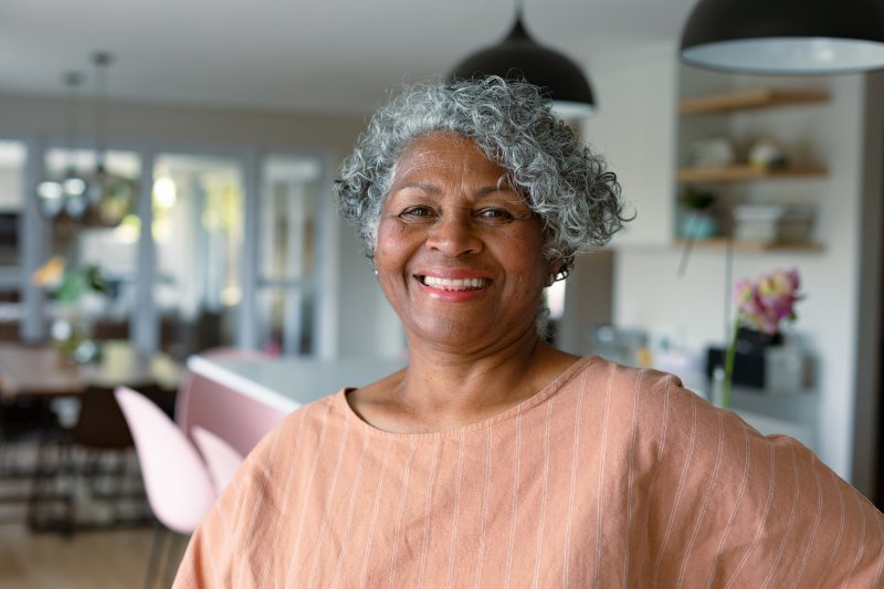 Smiling senior wearing dentures