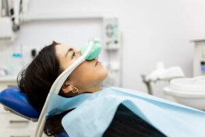 patient wearing a nasal mask in the dentist’s chair